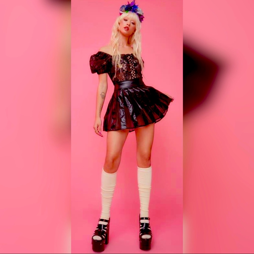 Chasing Moonlight Pleated Mini Skirt This pleated mini skirt has a vegan leather
